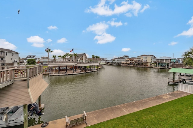 1302 Tiki Dr, Tiki Island, TX 77554 - dock area with boat lift, a water view, and a residential view
