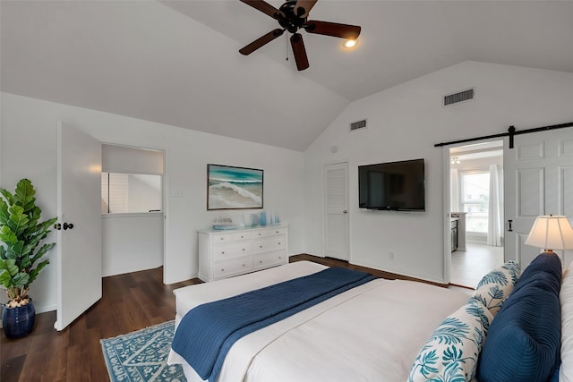 1302 Tiki Dr, Tiki Island, TX 77554 - bedroom with vaulted ceiling, wood finished floors, a barn door, baseboards, and a ceiling fan
