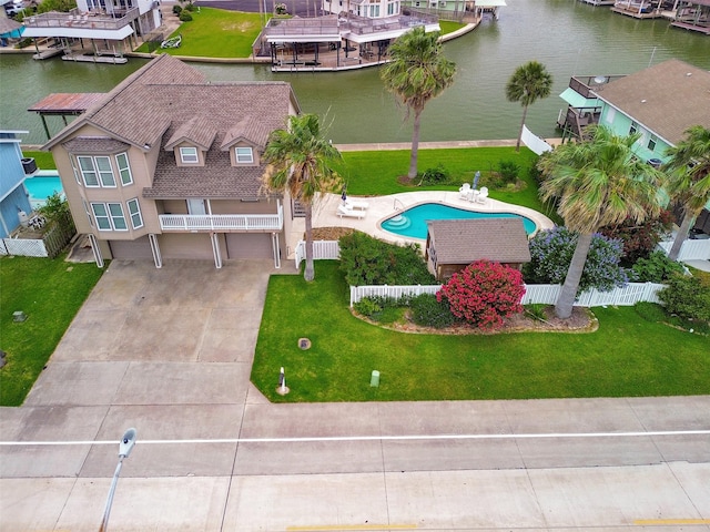 1302 Tiki Dr, Tiki Island, TX 77554 - view of subject property with a nearby body of water and a pool area