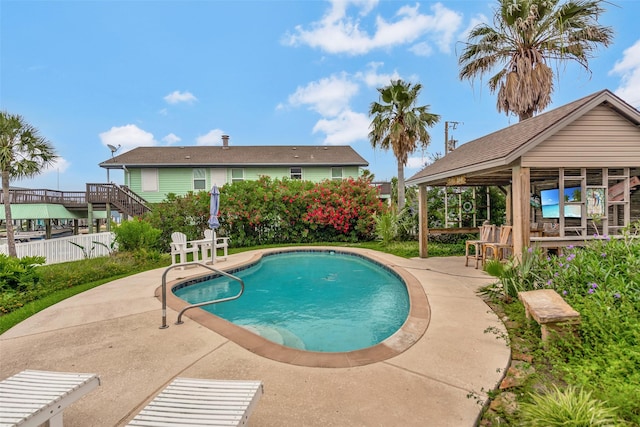 1302 Tiki Dr, Tiki Island, TX 77554 - outdoor pool with a patio area, stairs, and a gazebo