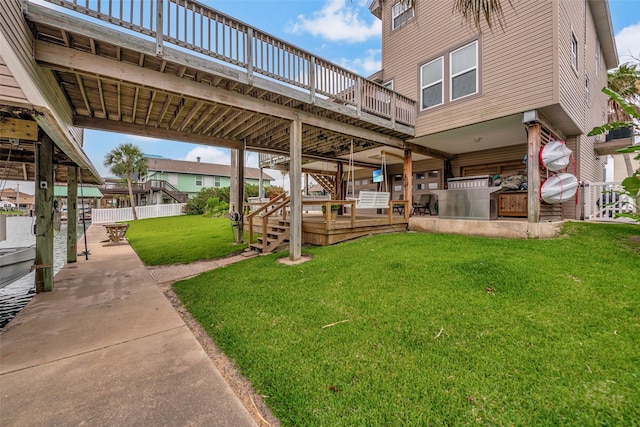 1302 Tiki Dr, Tiki Island, TX 77554 - view of yard with a wooden deck