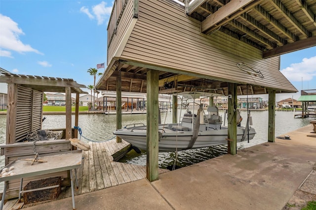 1302 Tiki Dr, Tiki Island, TX 77554 - dock area featuring boat lift and a water view