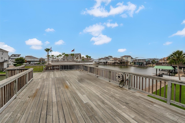 1302 Tiki Dr, Tiki Island, TX 77554 - wooden terrace with a residential view, boat lift, a water view, and a dock
