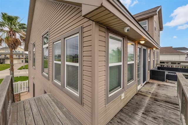 1302 Tiki Dr, Tiki Island, TX 77554 - view of property exterior with a surveillance system and a deck