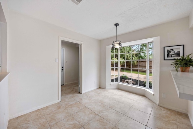 5427 Alba Rd, Houston, TX 77091 - unfurnished dining area featuring light tile patterned flooring and baseboards