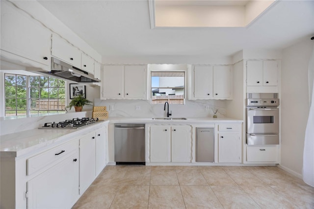 5427 Alba Rd, Houston, TX 77091 - kitchen with appliances with stainless steel finishes, a sink, a warming drawer, and plenty of natural light