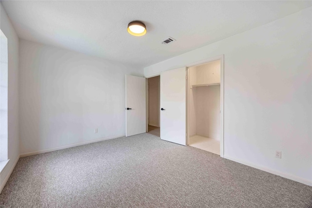 5427 Alba Rd, Houston, TX 77091 - unfurnished bedroom with light colored carpet, baseboards, and a closet