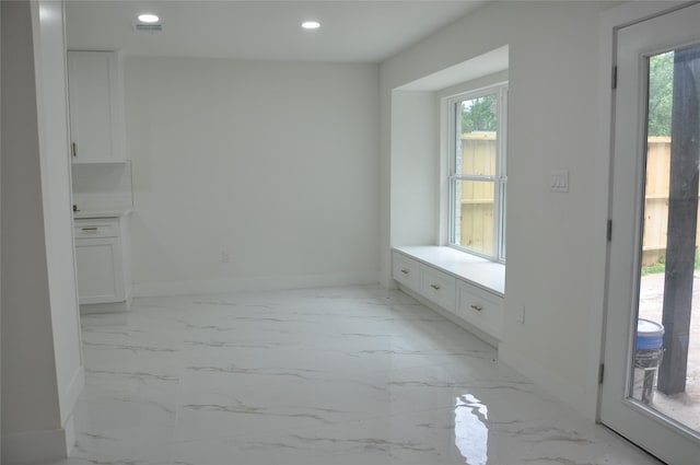 2522 Cassius Ct, New Caney, TX 77357 - bathroom featuring healthy amount of natural light, marble look tiles, recessed lighting, and vanity