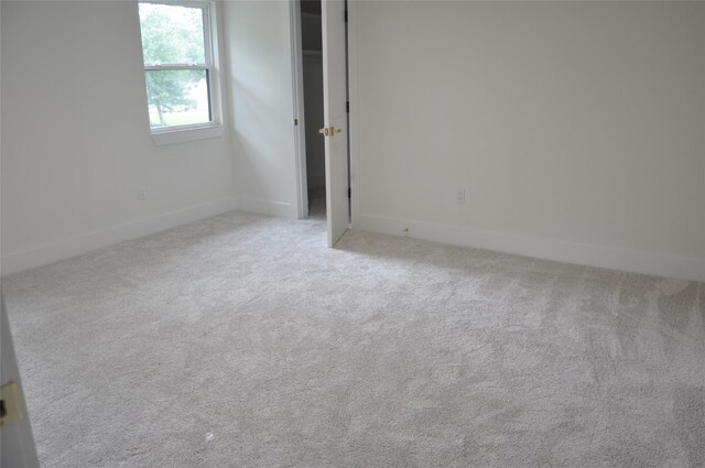 2522 Cassius Ct, New Caney, TX 77357 - unfurnished bedroom with carpet flooring and baseboards