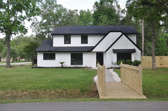 2522 Cassius Ct, New Caney, TX 77357 - modern inspired farmhouse featuring a shingled roof and brick siding