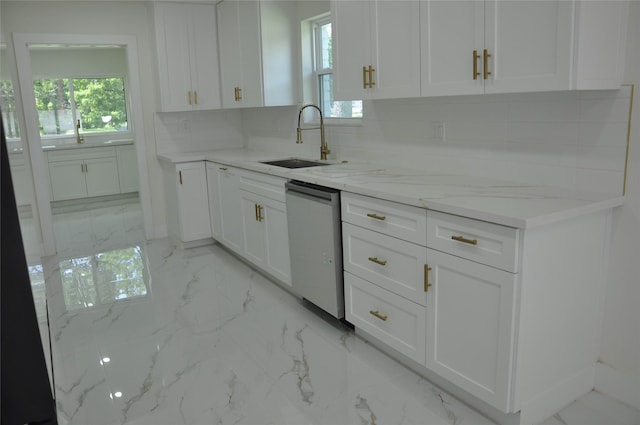 2522 Cassius Ct, New Caney, TX 77357 - kitchen with dishwasher, tasteful backsplash, white cabinetry, light stone countertops, and light marble finish floors