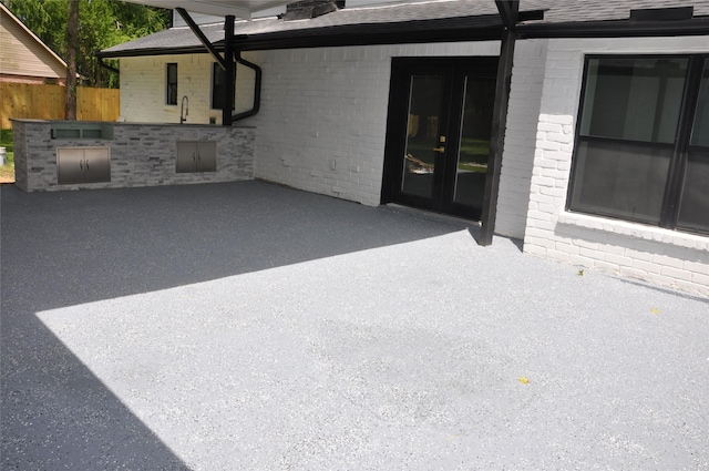 2522 Cassius Ct, New Caney, TX 77357 - view of patio featuring area for grilling and french doors