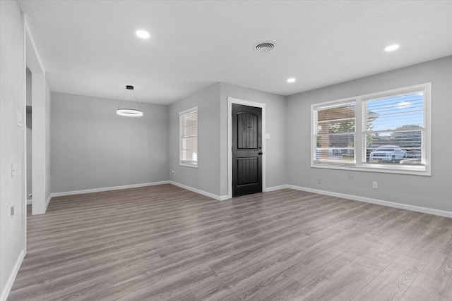 2408 Raymond St, Pasadena, TX 77506 - unfurnished room with plenty of natural light, wood finished floors, baseboards, and recessed lighting