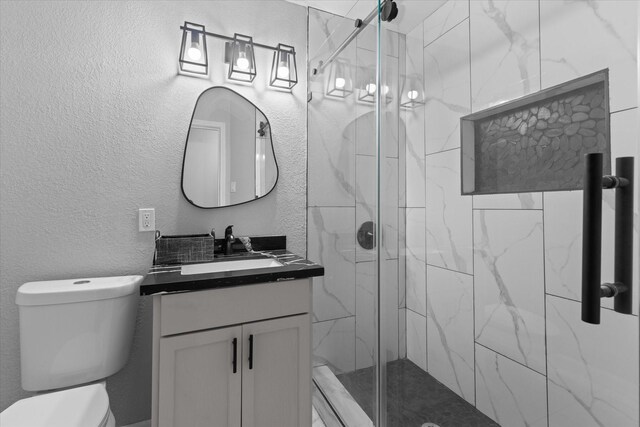 2408 Raymond St, Pasadena, TX 77506 - bathroom featuring toilet, vanity, and a marble finish shower