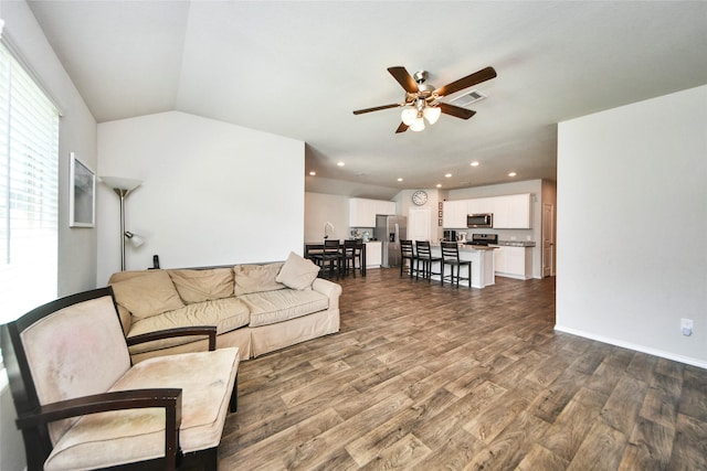 14133 Sharktooth Hill Ln, Conroe, TX 77384 - living area with dark wood-style floors, a ceiling fan, recessed lighting, and lofted ceiling