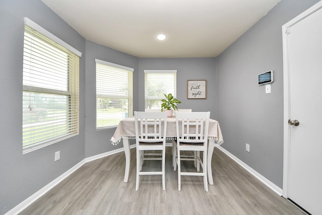 15543 Sheldon Ridge Way, Houston, TX 77044 - dining room featuring wood finished floors, baseboards, and recessed lighting
