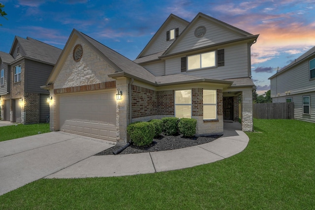15543 Sheldon Ridge Way, Houston, TX 77044 - view of front of property featuring an attached garage, concrete driveway, stone siding, brick siding, and roof with shingles
