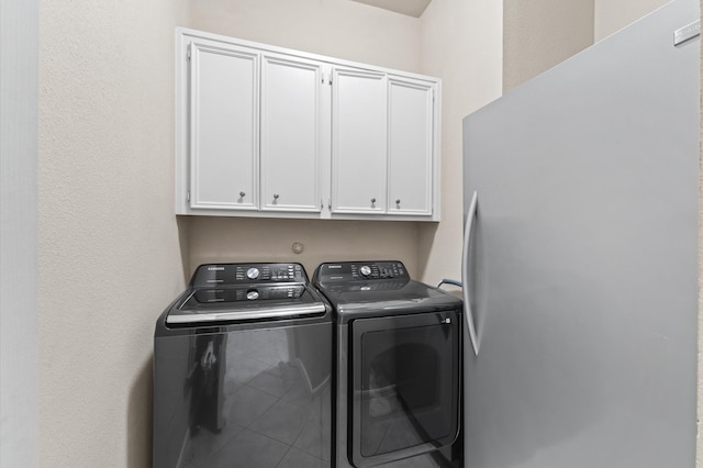 13727 Elm Shores Dr, Houston, TX 77044 - washroom featuring cabinet space and washing machine and clothes dryer