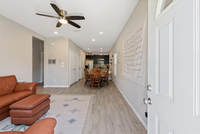 237 Ridgeside Ct, Montgomery, TX 77316 - living room with light wood-style flooring, recessed lighting, baseboards, and ceiling fan