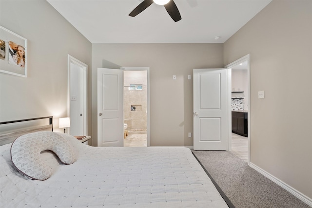 237 Ridgeside Ct, Montgomery, TX 77316 - carpeted bedroom with connected bathroom, baseboards, and a ceiling fan