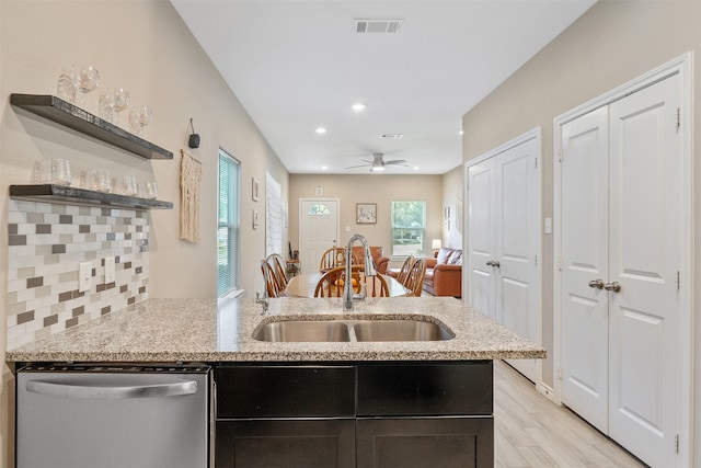 237 Ridgeside Ct, Montgomery, TX 77316 - kitchen featuring dishwasher, a sink, open shelves, recessed lighting, and a peninsula