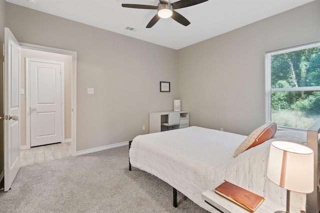 237 Ridgeside Ct, Montgomery, TX 77316 - carpeted bedroom with a ceiling fan and baseboards