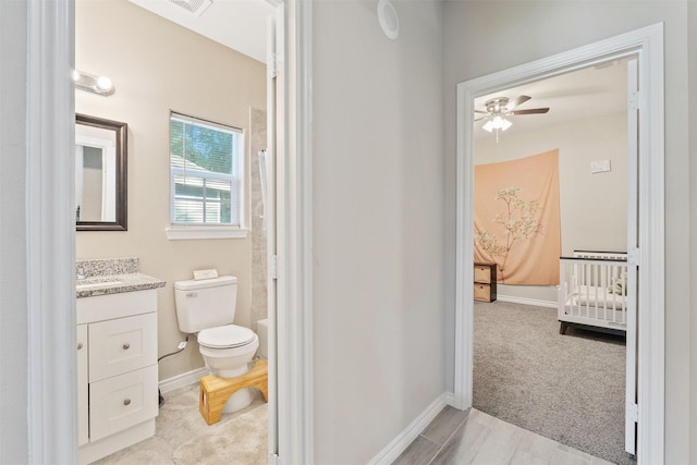 237 Ridgeside Ct, Montgomery, TX 77316 - full bathroom with vanity, toilet, ceiling fan, baseboards, and shower / bath combo with shower curtain
