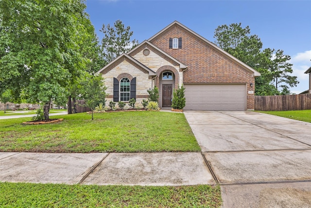 30510 Legend Oaks Ct, Magnolia, TX 77355 - view of front of house featuring stone siding, concrete driveway, a garage, and brick siding