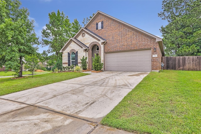 30510 Legend Oaks Ct, Magnolia, TX 77355 - view of front of house featuring a garage, brick siding, concrete driveway, and stone siding