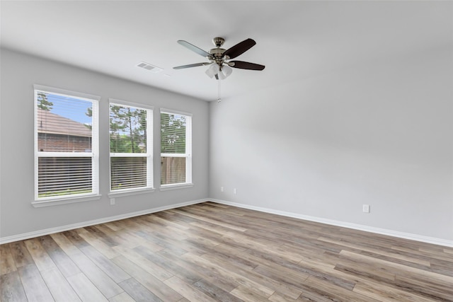 30510 Legend Oaks Ct, Magnolia, TX 77355 - unfurnished room featuring wood finished floors, baseboards, and a ceiling fan