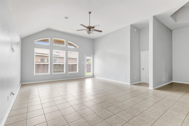 30510 Legend Oaks Ct, Magnolia, TX 77355 - spare room featuring lofted ceiling, ceiling fan, light tile patterned floors, and baseboards