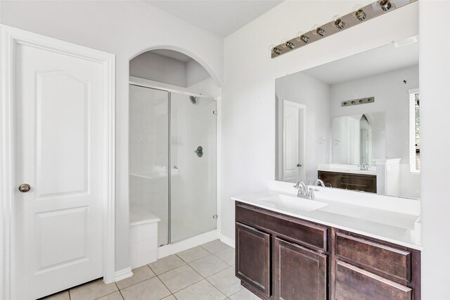 30510 Legend Oaks Ct, Magnolia, TX 77355 - full bath featuring a shower stall, vanity, tile patterned floors, and baseboards