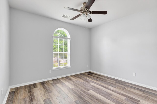30510 Legend Oaks Ct, Magnolia, TX 77355 - unfurnished room with wood finished floors, ceiling fan, and baseboards