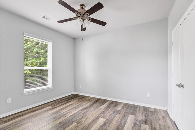 30510 Legend Oaks Ct, Magnolia, TX 77355 - unfurnished room with wood finished floors, baseboards, and ceiling fan