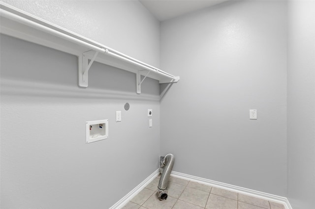 30510 Legend Oaks Ct, Magnolia, TX 77355 - laundry area with electric dryer hookup, baseboards, washer hookup, and light tile patterned flooring
