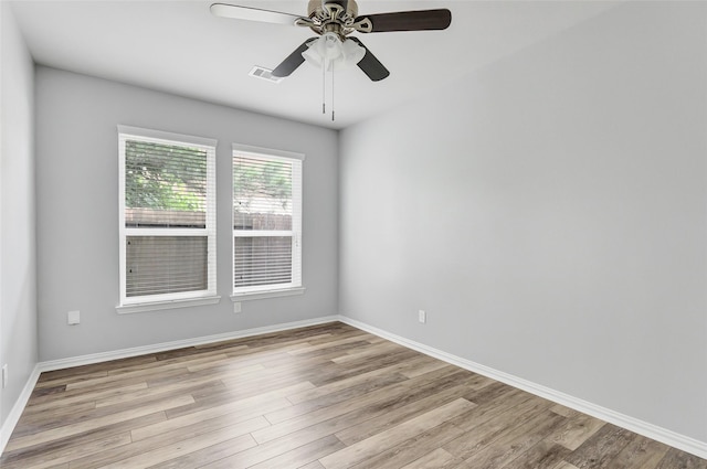 30510 Legend Oaks Ct, Magnolia, TX 77355 - unfurnished room with light wood-style flooring, a ceiling fan, and baseboards