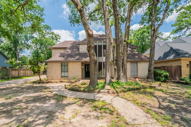 6914 Coral Ridge Rd, Houston, TX 77069 - mid-century modern home featuring brick siding and roof with shingles