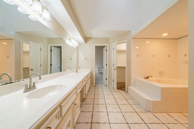 6914 Coral Ridge Rd, Houston, TX 77069 - bathroom with a garden tub, tile patterned flooring, double vanity, and a walk in closet