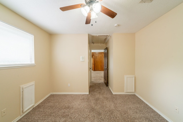 6914 Coral Ridge Rd, Houston, TX 77069 - carpeted empty room with attic access, ceiling fan, and baseboards