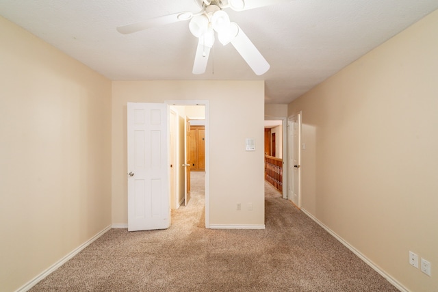 6914 Coral Ridge Rd, Houston, TX 77069 - unfurnished bedroom with carpet flooring, baseboards, and ceiling fan