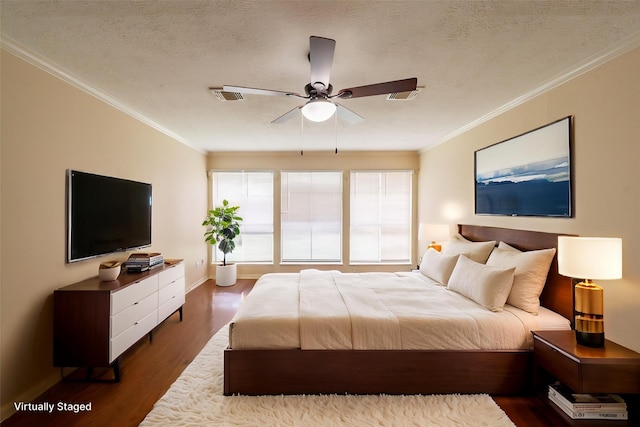 6914 Coral Ridge Rd, Houston, TX 77069 - bedroom featuring dark wood-style floors, ornamental molding, baseboards, ceiling fan, and a textured ceiling