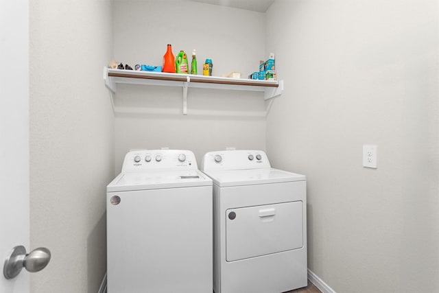 1217 Antelope Passing Dr, Montgomery, TX 77316 - washroom featuring washing machine and clothes dryer and baseboards