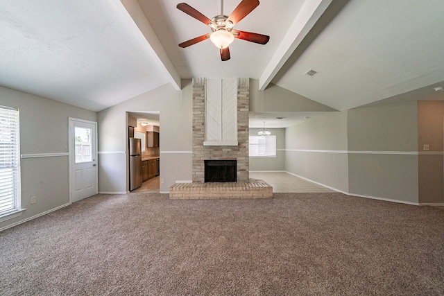 3614 Cheaney Dr, Houston, TX 77066 - unfurnished living room featuring ceiling fan, healthy amount of natural light, a brick fireplace, and light carpet