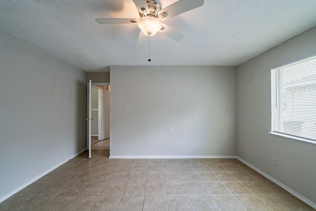 3614 Cheaney Dr, Houston, TX 77066 - spare room featuring light tile patterned flooring, ceiling fan, and baseboards