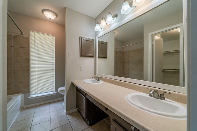 3614 Cheaney Dr, Houston, TX 77066 - full bath featuring tile patterned floors, toilet, double vanity, and shower / washtub combination