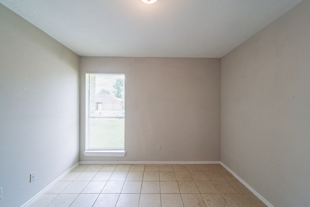 3614 Cheaney Dr, Houston, TX 77066 - unfurnished room with baseboards and light tile patterned flooring