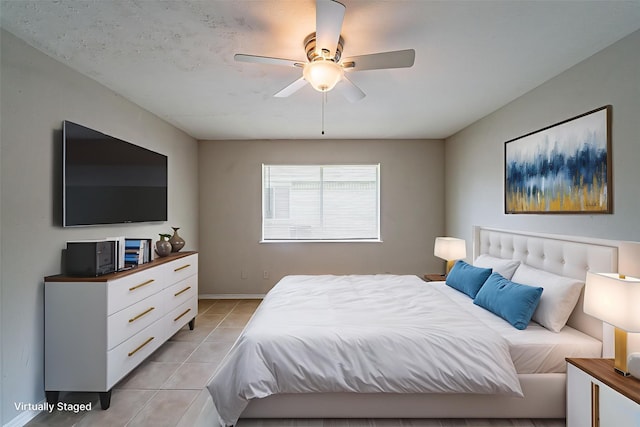 3614 Cheaney Dr, Houston, TX 77066 - bedroom with light tile patterned floors, baseboards, and a ceiling fan