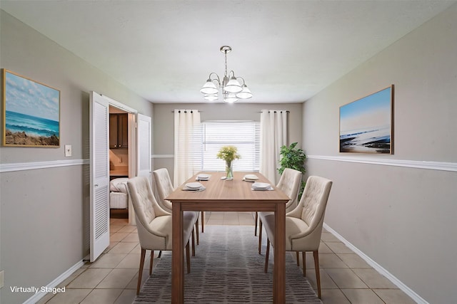 3614 Cheaney Dr, Houston, TX 77066 - dining area with light tile patterned flooring, a chandelier, and baseboards