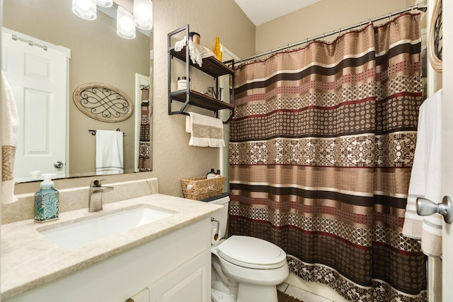 350 Pecan Estates Rd, Angleton, TX 77515 - full bathroom with a textured wall, vanity, toilet, and a shower with shower curtain