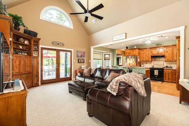 350 Pecan Estates Rd, Angleton, TX 77515 - living room featuring a ceiling fan, light colored carpet, high vaulted ceiling, and french doors